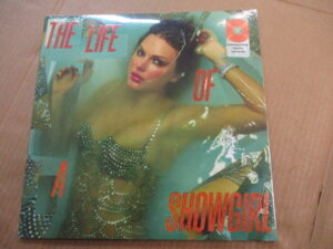The Life Of A Showgirl (PORTOFINO ORANGE GLITTER VINYL)